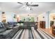 Expansive living room with ceiling fans, hardwood floors, and ample seating at 5357 Highway 81, Loganville, GA 30052