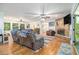 Spacious living room features a brick fireplace and hardwood floors, creating a cozy and inviting atmosphere at 5357 Highway 81, Loganville, GA 30052