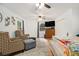Bright main bedroom features ceiling fans, sitting area and hardwood floors at 5357 Highway 81, Loganville, GA 30052