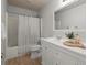 Bright bathroom with a shower, tub, and vanity sink at 216 Toonigh Way, Canton, GA 30115