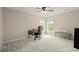 Bedroom with a large window, ceiling fan, and space for a desk at 216 Toonigh Way, Canton, GA 30115