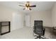 Spacious bedroom with closet, ceiling fan, and modern desk at 216 Toonigh Way, Canton, GA 30115