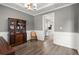 Elegant dining room with a vintage china cabinet and a view into the kitchen at 216 Toonigh Way, Canton, GA 30115