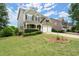 Well-manicured lawn and landscaping complement this lovely home with a two-car garage at 216 Toonigh Way, Canton, GA 30115