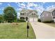 Beautifully landscaped front yard with mature trees enhance this two-story home's curb appeal at 216 Toonigh Way, Canton, GA 30115