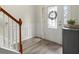 Welcoming foyer with hardwood floors, wainscoting, and decorative door at 216 Toonigh Way, Canton, GA 30115