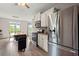 Updated kitchen featuring stainless steel appliances and gray cabinets at 216 Toonigh Way, Canton, GA 30115