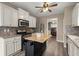 Modern kitchen with stainless appliances, an island, and stylish backsplash at 216 Toonigh Way, Canton, GA 30115