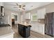 Kitchen with white cabinets, stainless appliances, island, open layout at 216 Toonigh Way, Canton, GA 30115