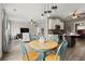 Open-concept with eat-in dining and kitchen and living room with tv at 216 Toonigh Way, Canton, GA 30115