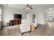 Open floor plan with living room including hardwood floors and a sitting area at 216 Toonigh Way, Canton, GA 30115