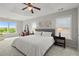 Bright main bedroom features a tray ceiling, and plenty of natural light at 216 Toonigh Way, Canton, GA 30115