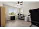 Home office featuring a work space, large windows, and treadmill at 216 Toonigh Way, Canton, GA 30115