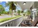 Relaxing porch view with chairs and lush green surroundings creating a welcoming atmosphere at 216 Toonigh Way, Canton, GA 30115