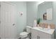 Well lit half bath featuring a modern vanity and stylish mirror at 216 Toonigh Way, Canton, GA 30115