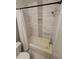 Bathroom with a bathtub and white tiles at 2805 Ne Expressway Unit A24, Atlanta, GA 30345