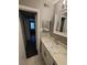Bathroom with a mirror, sink, and view into the bedroom at 2805 Ne Expressway Unit A24, Atlanta, GA 30345