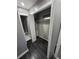 Open closet with gray walls, white shelves, white trim, and dark wood floors at 2805 Ne Expressway Unit A24, Atlanta, GA 30345