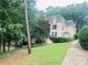 Two-story brick building with green shutters and landscaping along the sidewalk at 2805 Ne Expressway Unit A24, Atlanta, GA 30345