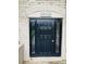 Contemporary black front door with sidelights and 'A21-A24' address plate at 2805 Ne Expressway Unit A24, Atlanta, GA 30345