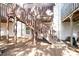 Backyard featuring an external staircase leading up to a deck and a small grassy area at 2928 George Busbee Pkwy, Kennesaw, GA 30144