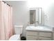 Bright bathroom with a shower-tub combo, modern sink, vanity, and neutral colors, offering a clean aesthetic at 2928 George Busbee Pkwy, Kennesaw, GA 30144