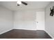 Bedroom with hardwood floors, large windows, and a ceiling fan at 2928 George Busbee Pkwy, Kennesaw, GA 30144