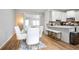 Open-concept dining area connected to a kitchen bar, offering a functional layout at 2928 George Busbee Pkwy, Kennesaw, GA 30144