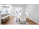 Modern dining area features stylish chairs, a glass table and an area rug, creating an inviting space at 2928 George Busbee Pkwy, Kennesaw, GA 30144