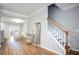 Bright hallway with wood floors, access to dining area, and a staircase at 2928 George Busbee Pkwy, Kennesaw, GA 30144