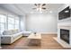 Spacious living room featuring a fireplace, hardwood floors, and lots of natural light at 2928 George Busbee Pkwy, Kennesaw, GA 30144