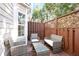 Private patio featuring a conversation set of outdoor furniture with a privacy fence at 2928 George Busbee Pkwy, Kennesaw, GA 30144