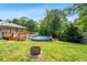 Backyard featuring an above-ground pool, fire pit, and wooden deck at 3153 Bonway Dr, Decatur, GA 30032