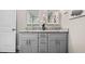 Bathroom featuring granite countertop, dual sinks and modern fixtures at 3153 Bonway Dr, Decatur, GA 30032