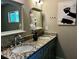Modern bathroom featuring double sinks with granite countertops and decorative lighting at 3153 Bonway Dr, Decatur, GA 30032