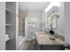 Well lit bathroom featuring granite countertop, single sink and modern fixtures at 3153 Bonway Dr, Decatur, GA 30032