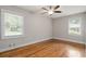 Bedroom featuring hardwood floors, ceiling fan, neutral paint and two windows at 3153 Bonway Dr, Decatur, GA 30032