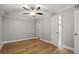 Spacious bedroom featuring a ceiling fan, wood floors, and neutral-toned walls at 3153 Bonway Dr, Decatur, GA 30032