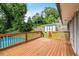 A wooden deck offers views of the above-ground pool, backyard shed, and fenced yard of this property at 3153 Bonway Dr, Decatur, GA 30032