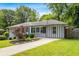 Beautiful view of the home's exterior with a well-maintained lawn and landscaping at 3153 Bonway Dr, Decatur, GA 30032