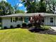 Charming single-story home with well-manicured lawn and inviting blue door at 3153 Bonway Dr, Decatur, GA 30032