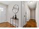 Inviting hallway with hardwood floors, stylish console table and modern decor at 3153 Bonway Dr, Decatur, GA 30032