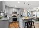 Open kitchen with stainless appliances, granite counters, and bar stool seating at 3153 Bonway Dr, Decatur, GA 30032