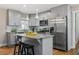 Modern kitchen featuring stainless steel appliances, granite counters, and a center island at 3153 Bonway Dr, Decatur, GA 30032