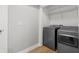 Laundry room featuring gray washer and dryer and wood floor at 3153 Bonway Dr, Decatur, GA 30032