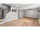 Spacious living room featuring wood floors, stairs, recessed lights, and neutral walls at 3153 Bonway Dr, Decatur, GA 30032