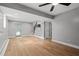 Spacious living room featuring wood floors, stairs, recessed lights, and neutral walls at 3153 Bonway Dr, Decatur, GA 30032