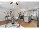 Open-concept living and dining area with hardwood floors and stylish furnishings at 3153 Bonway Dr, Decatur, GA 30032
