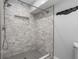 Tiled walk-in shower featuring a tiled niche and neutral colors at 3153 Bonway Dr, Decatur, GA 30032