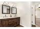 Spa-like bathroom with double vanity, granite countertops, and barnwood-style cabinets at 3444 Underwood Se Ct, Conyers, GA 30013